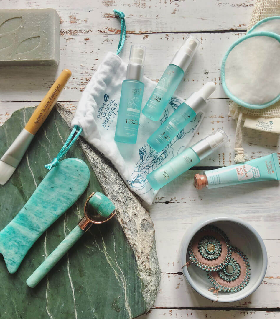 skinkit front flatlay with gua sha and facial roller