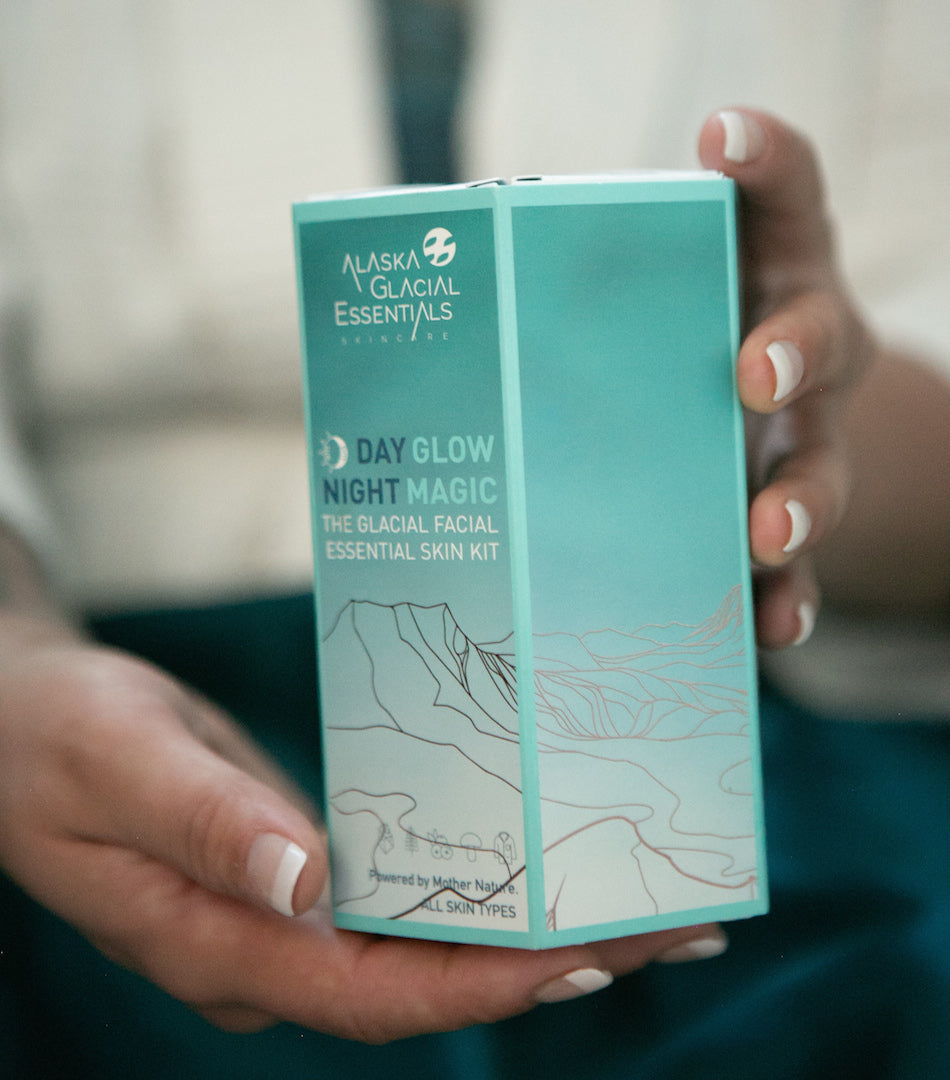 Woman holding The Glacial Facial Essential Skin Kit