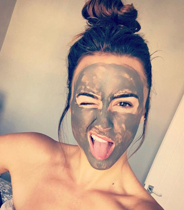 women smiling with mask applied