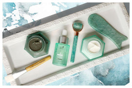 flat lay image of skin ritual products with link to weekly rituals page
