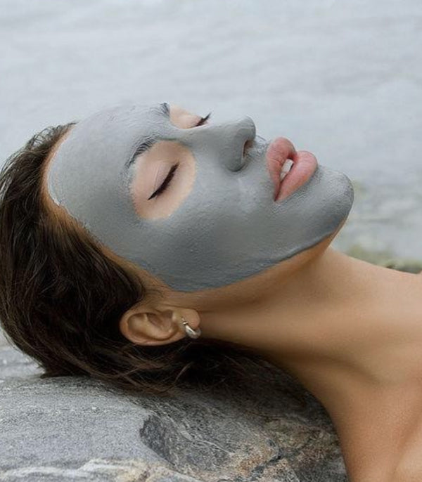 woman Alaska glacial mud mask